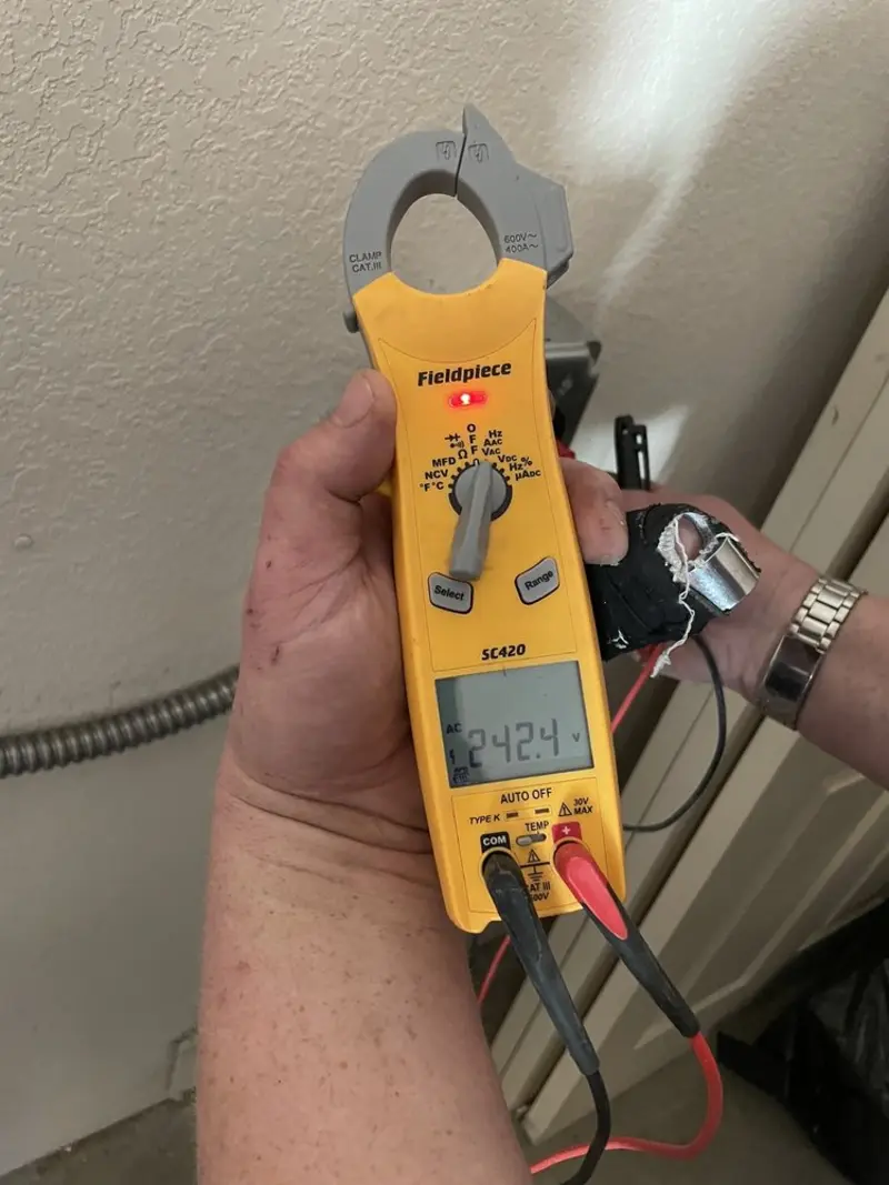 Voltage testing with clamp meter during Electrical Installation Services in Sayreville